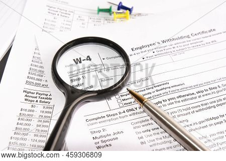 Blank W4 Tax Form, Magnifier And A Pen On Table, Tax Season, Business Concept