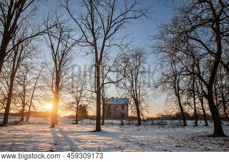 Panorama Of A Decayed Abandoned Train Station In Winter, At Dusk. It Is The Neglected And Decaying I