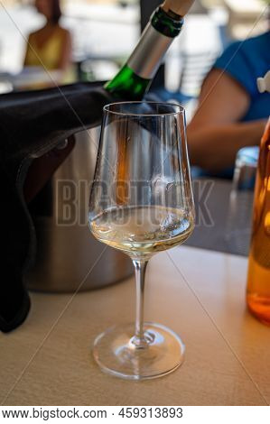 Drinking Of Txakoli Or Chacolí Slightly Sparkling Very Dry White Wine Produced In Spanish Basque Cou