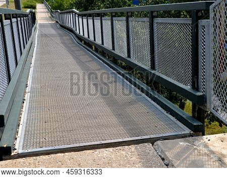 Access Ramp For Disabled And Wheelchair Users. The Elevation Is Spread Over The Long Length Of The P