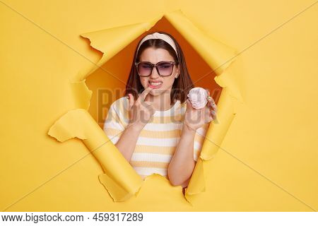 Portrait Of Caucasian Woman Wearing Hair Band And Striped T Shirt Felling Discomfort In Her Teeth, P