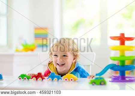 Boy Playing Toy Cars. Kid With Toys. Child And Car