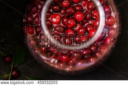 Homemade Liqueur From Cherries In A Jar Of A Natural Fermentation Process. Ukrainian Tincture.