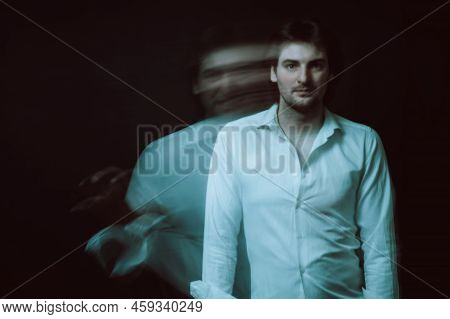 Schizophrenic Abstract Blurry Portrait Of Man With Mental Disorders And Mental Illnesses On Dark Bac