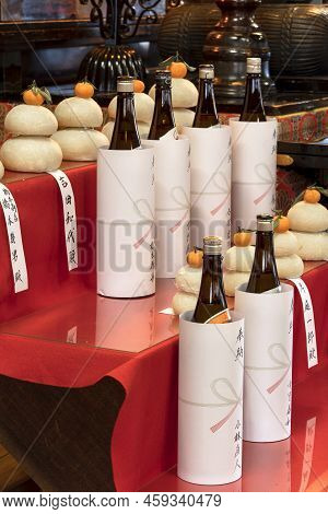 Tokyo, Japan - January 07 2022: Bottles Of Sake Rice Liquor Placed As Offerings In Front Of Kagami M