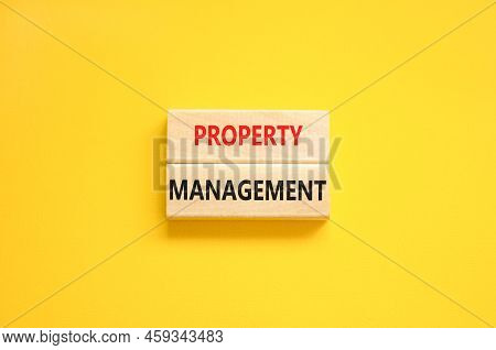 Property Management Symbol. Concept Words Property Management On Wooden Blocks On A Beautiful Yellow
