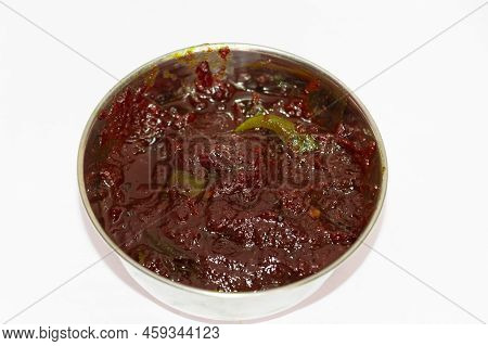 South Indian Special Traditional Side Dish Ginger Pickle Or Puli Inji In White Background