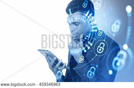 Black Businessman With Tablet In Hands, Pensive Look With Hand On Chin. Double Exposure With Glowing