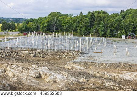 View Of Construction Industrial Area With Concrete Piles Driven Into Ground. Sweden.