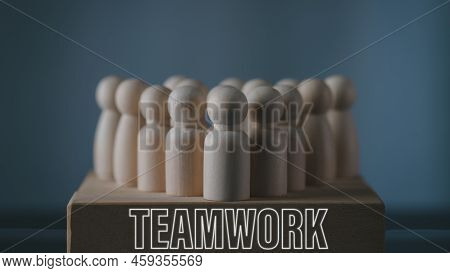 Teamwork Concept; Working Together For Future Goals; Wooden Doll Or Figure Standing On Wooden Cube L