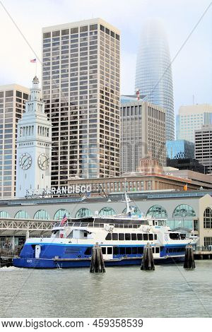 July 24, 2022 In San Francisco, Ca:  Ferry Boat Docked At The Historical Ferry Building With The Dow