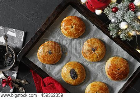 Traditional Christmas Austrian Pies Mohnzelten Cooking Paper With Christmas Tree And Toys In Backgro