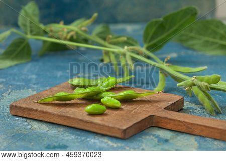Raw Green Edamame Soybeans. Edamame, Fresh Green Soybeans In Pod. Healthy Vegan Food.