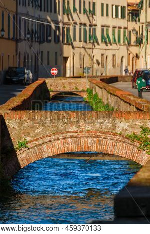 'via Del Fosso' Or 'via Dei Fossi' (moat Street) In Lucca Historical Center, With Its Characteristic