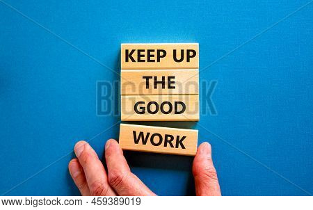 Keep Up The Good Work Symbol. Concept Words Keep Up The Good Work On Wooden Blocks. Businessman Hand