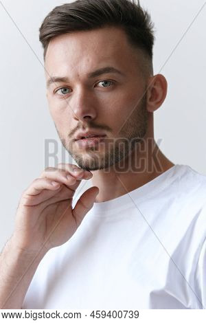 Portrait Shot Of Handsome Pensive Romantic Serious Tanned Man Guy In Basic T-shirt Looks At Camera P
