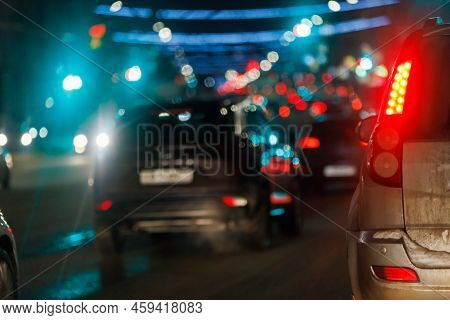 Blurry Winter Night City Street Traffic. Unadorned Real-life Shot Fom Inside Car