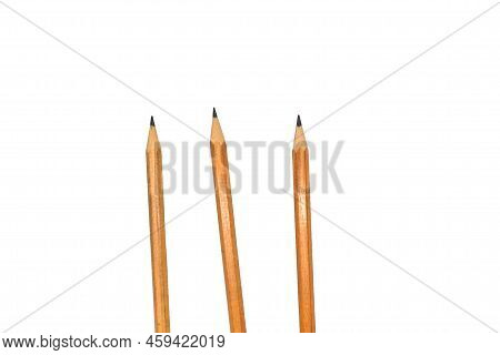 Pencils On A White Background. In The Photo There Are 3 Pencils On A White Background.