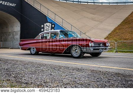 Lebanon, Tn - May 14, 2022: Wide Angle Side View Of A 1960 Buick Invicta Sedan Driving On A Road Lea