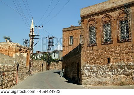 A View Of One Of The Streets Of The Historical Part Of The City Of Midyat With Houses And A Mosque W