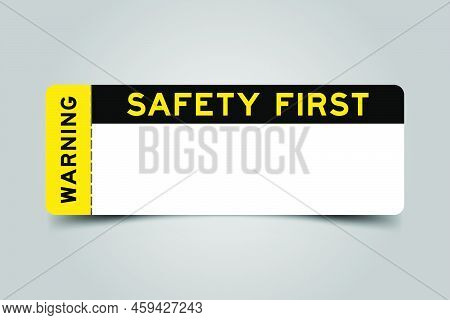 Yellow And Black Color Ticket With Word Warning And Safety First And Have White Copy Psace On Gray B