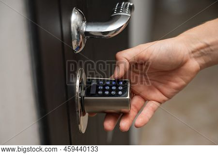 Woman Opens The Combination Lock On The Door To The Apartment. Keyless Entry.