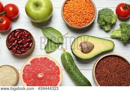 Different Vegetables, Seeds And Fruits On White Wooden Table, Flat Lay. Healthy Diet