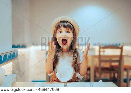 Funny Girl Screaming With Happiness In A Restaurant