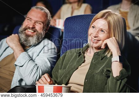 Selective Focus Of Mature Caucasian Woman And Her Husband Spending Time Together Watching Interestin