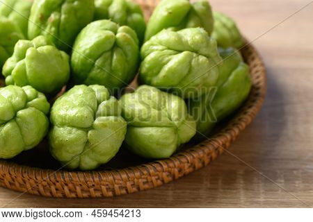 Chayote Squash Fruit In Basket On Wooden Table, Organic Vegetables