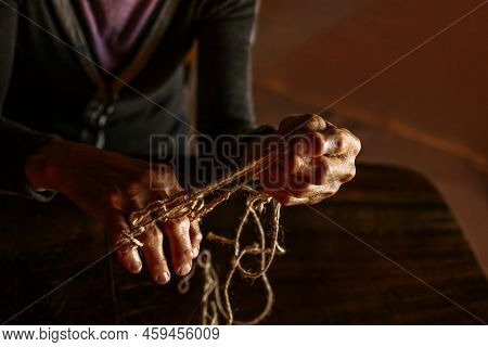 Hands Of Old Woman With Polyarthritis Disease. Canvas Strings On Fingers Of Elderly Lady, Puppets. H