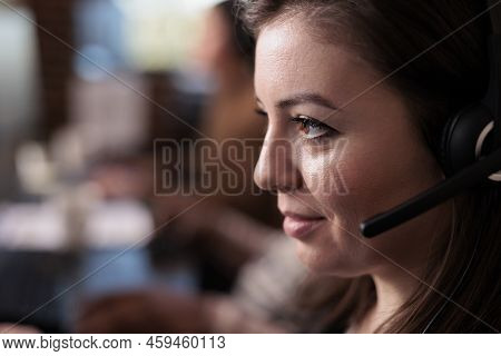 Telecommunication Receptionist Answering Client Call On Headset, Talking To People On Remote Helplin