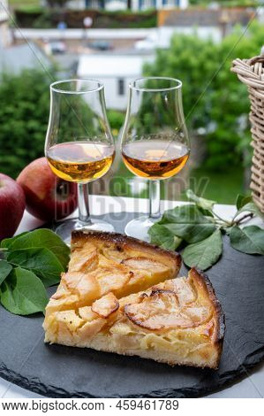 Tasting Of Baked Apple Cake And Strong Alcoholic Drink Calvados Made From Apples In Normandy, Calvad