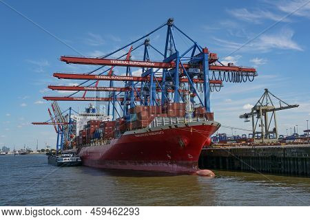 Hamburg, Germany, August 3, 2022: Large Container Vessel Navios Indigo With Stacked Freight Under Th