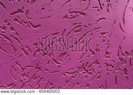 Close Shot Of Fuchsia Colored Worm Stucco Wall Finish