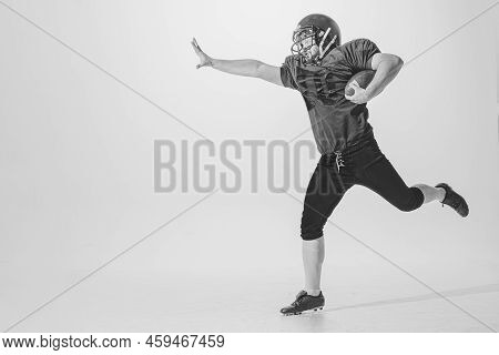 Dynamic Portrait Of American Football Player In Action And Motion Isolated On White Background. Conc
