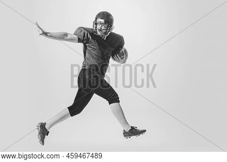 Dynamic Portrait Of American Football Player In Action And Motion Isolated On White Background. Conc