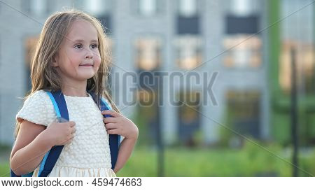 Shy Preschooler Girl Goes To Preparatory Form With Excited And Happy Expression. Girl Holding School