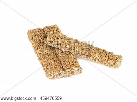 Three Strips Of Kozinak From Seeds And Molasses On A White Background. Delicious Oriental Sweets Koz