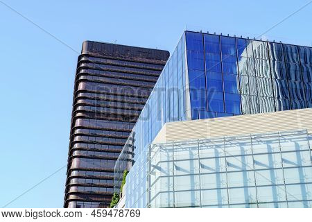 Madrid, Spain - July 30, 2022: Geometric Shapes Of Modern Steel And Glass Buildings On Blue Sky In T