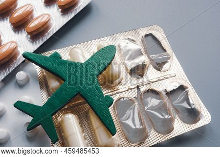 The Figurine Of The Plane Lies On The Pills. Travel And Medicine.