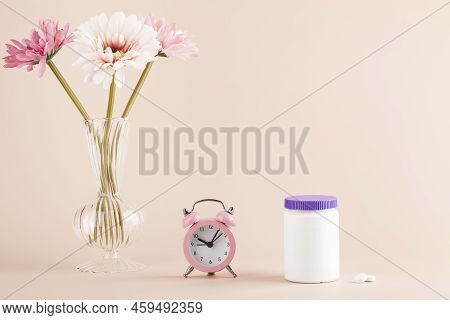 Women Health, Middle Age And Menopause Concept. Health Care Style. Copy Space. White Plastic Bottle 
