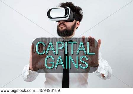 Text Sign Showing Capital Gains. Business Concept Bonds Shares Stocks Profit Income Tax Investment F