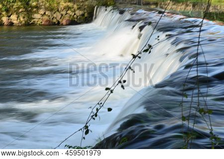 Water Flowing In Winter Over The River Neiva