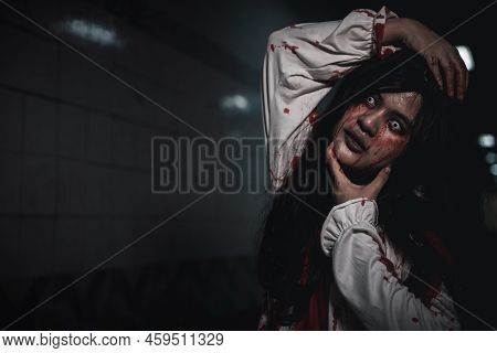 Horror Bloodthirsty Woman Ghost Or Zombie She Is Horror Scary With Breaks Her Neck At Dark Night, Sc