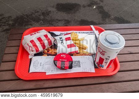 Oradea, Romania - June 9, 2022: Kfc Menu With Real Burger Picant, French Fries, Ketchup And Pepsi.