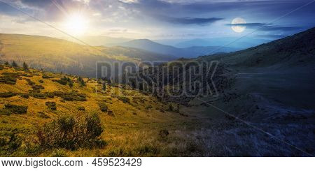 View In To The Mountain Valley At Twilight. Day And Night Time Change Concept. Beautiful Summer Land