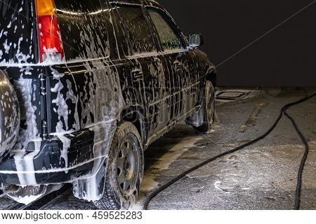 Washing Black Car With Active Foam. The Car Is Serviced At The Sink. Car Wash Self-service. Removal 
