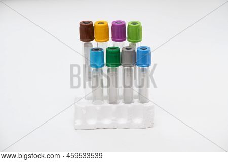 Two Vacuum Tubes For Collection Blood Samples Witn Christmas Three On White Background