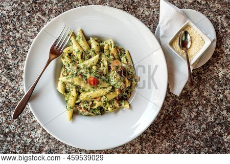 Prosciutto Penne With Spinach - Colorful Pasta Plate Served With Parmigiano Reggiano